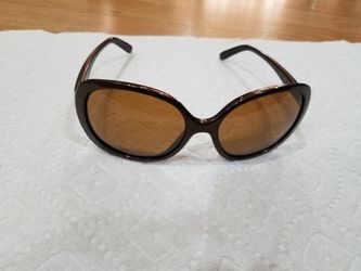 Oakley polarized sunglasses backhand woman....