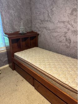 Twin bed with drawers and book shelf