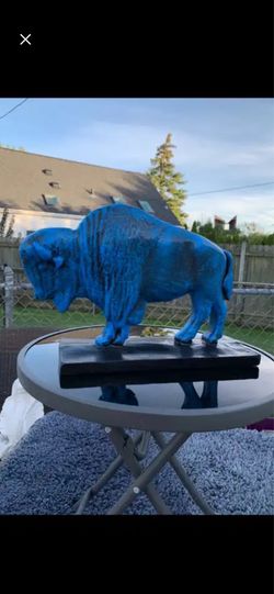 The old blue buffalo statue