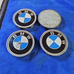 4 BMW WHEEL CENTER CUPS.