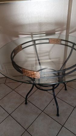 Glass top table.  Indoors or out. No chairs