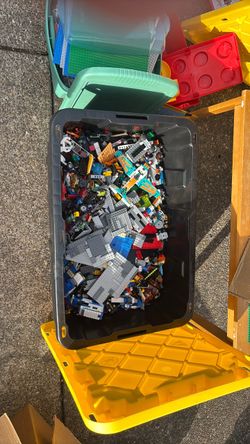 Lego table and assorted legos from different Lego sets with instructions