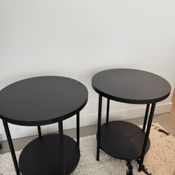 Two Round Black Tables 