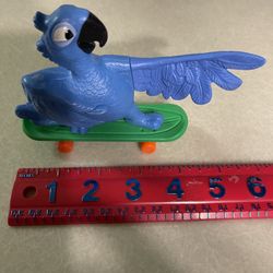 CA. 2011. RIO. BLUE MACAW BIRD WITH SKATE BOARD. McDONALDS