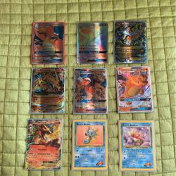 A Set Of Charizrads And Some Two Other Cards