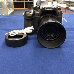 Panasonic LUMIX GH4 4K Mirrorless Camera 16MP With 1 45-150mm Lens, 1 Battery & 1 Aftermarket Charger 