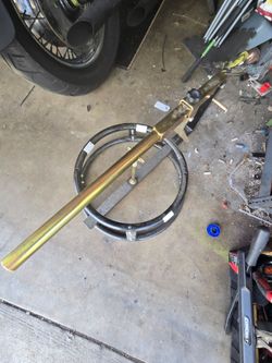 Motorcycle tire changer with bead breaker.