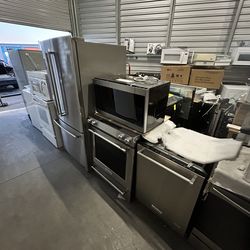 Kitchen appliances refrigerator stove dishwasher microwave