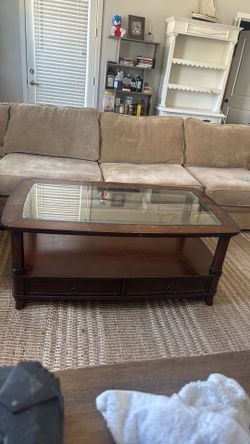 Wooden coffee table with glass top