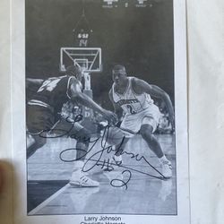 Basketball, autographed, black-and-white photograph featuring Larry Johnson of the Charlotte Hornets