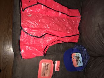 Hunting fishing outdoors florescent orange vest, blue duck hat, license tag holder