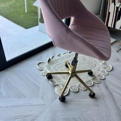 dusty pink velvet desk chair with gold legs on caster wheels 
