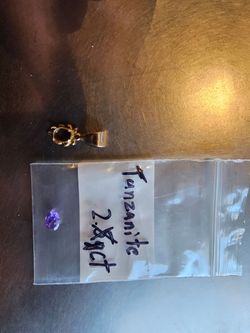 (NEED GONE ASAP)10kt gold pendant with a double a graded tanzanite stone