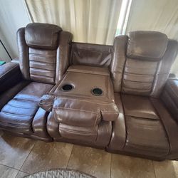 Brown leather reclining couch