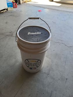 Bucket of used and and 3 new Baseballs