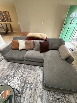 Grey 3 piece sofa with reversible chaise.