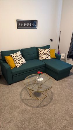 Green couch with chaise and storage