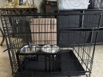 dog cage almost new with bowls