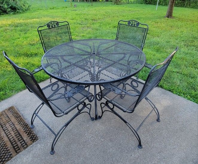 Black Wrought Iron Table and Four Chairs