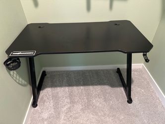 Gaming table black in color.