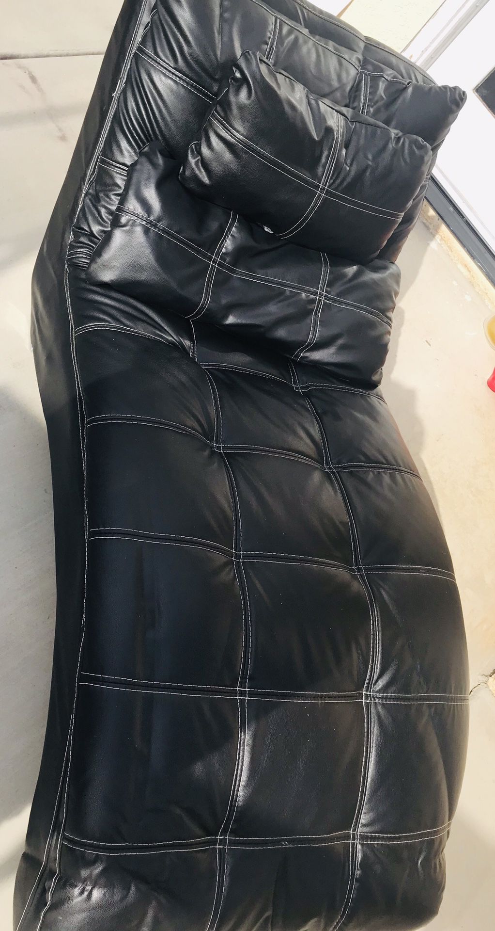 Black leather couch bed