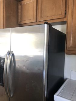 GE.   Side By Side  Stain steel  Cold Working Condition 