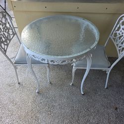 Wrought Iron Table and Two Matching Chairs