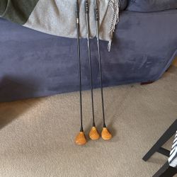 Three vintage blonde, ping clubs with graphite shafts