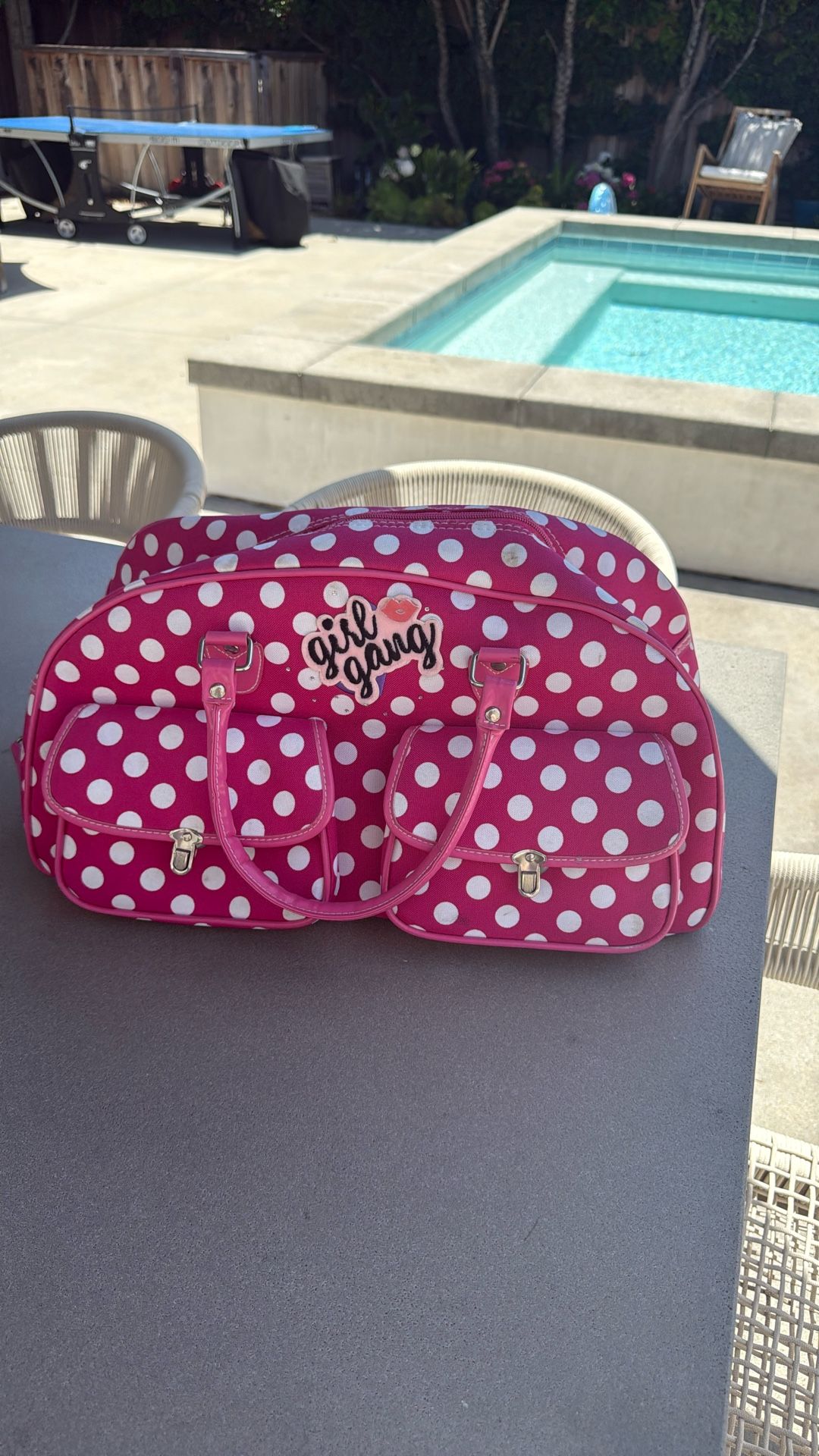 Polka dot pink duffle bag