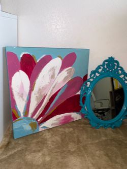 A set of a turquoise mirror and a flower painting