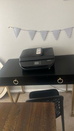 Black desk with gold legs