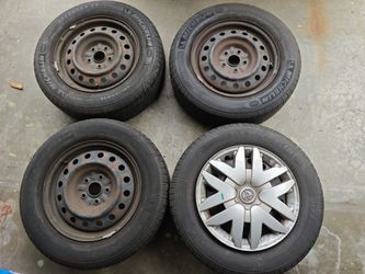 Michelin Defender XT Tires & Rims – 215/65R16 (Fits Toyota Sienna) – $250