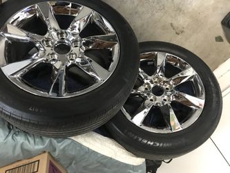 Two 17 inch chrome Acura wheels with tires