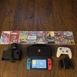 NINTENDO SWITCH WITH 8 GAMES, 2 CONTROLLERS, TRAVEL CASE