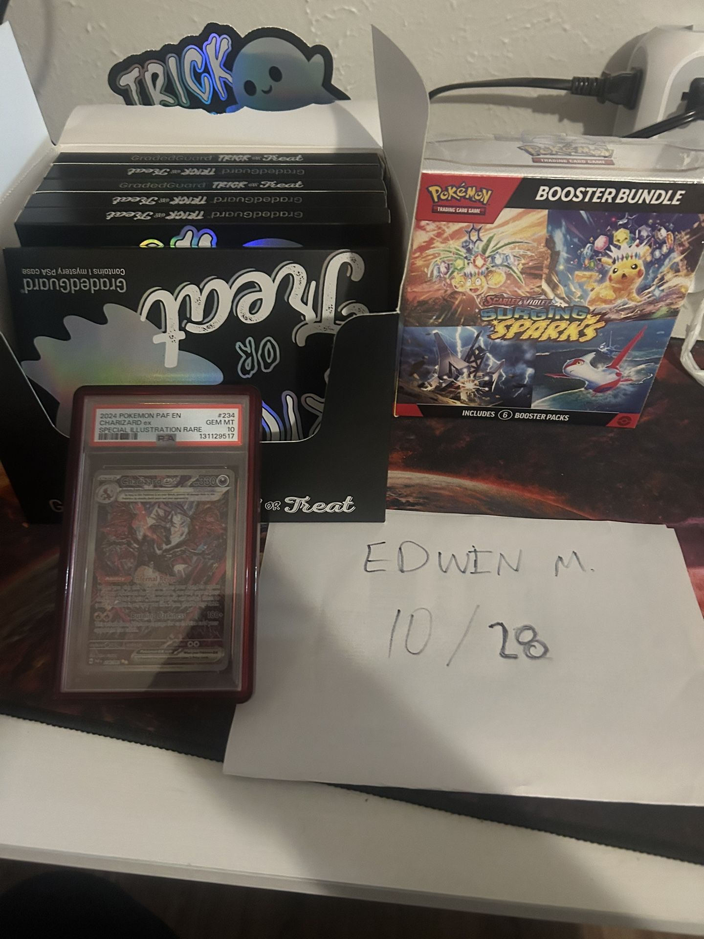 PSA 10 paldean Fates Charizard, Surging Sparks Booster Bundle, Trick Or treat Graded Guard
