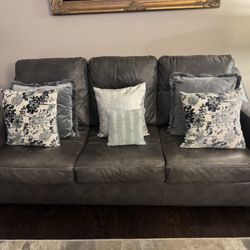 Ashley’s Kensbridge Charcoal Leather Queen Sleeper Sofa