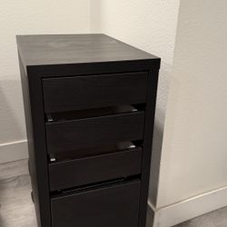 IKEA - Compact Black rolling file cabinet in great condition.  Perfect for home office or small spaces.  Features: 	•	4 drawers (3 small + 1 larg