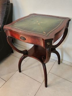 Vintage two-tier Wood Accent Table with beautiful brass lions and carved details