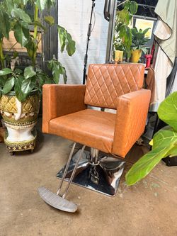 Brown adjustable swivel barber chair