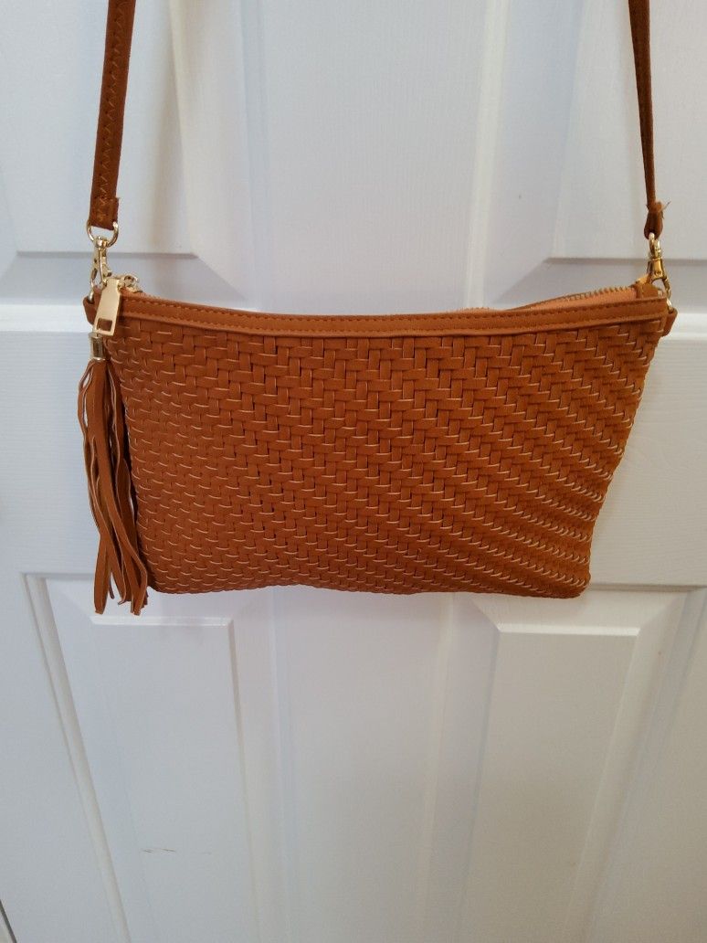 A Beautiful Brand New Purse To be Small you can put Alot In Side  .    Size  . 9"×  11" . 