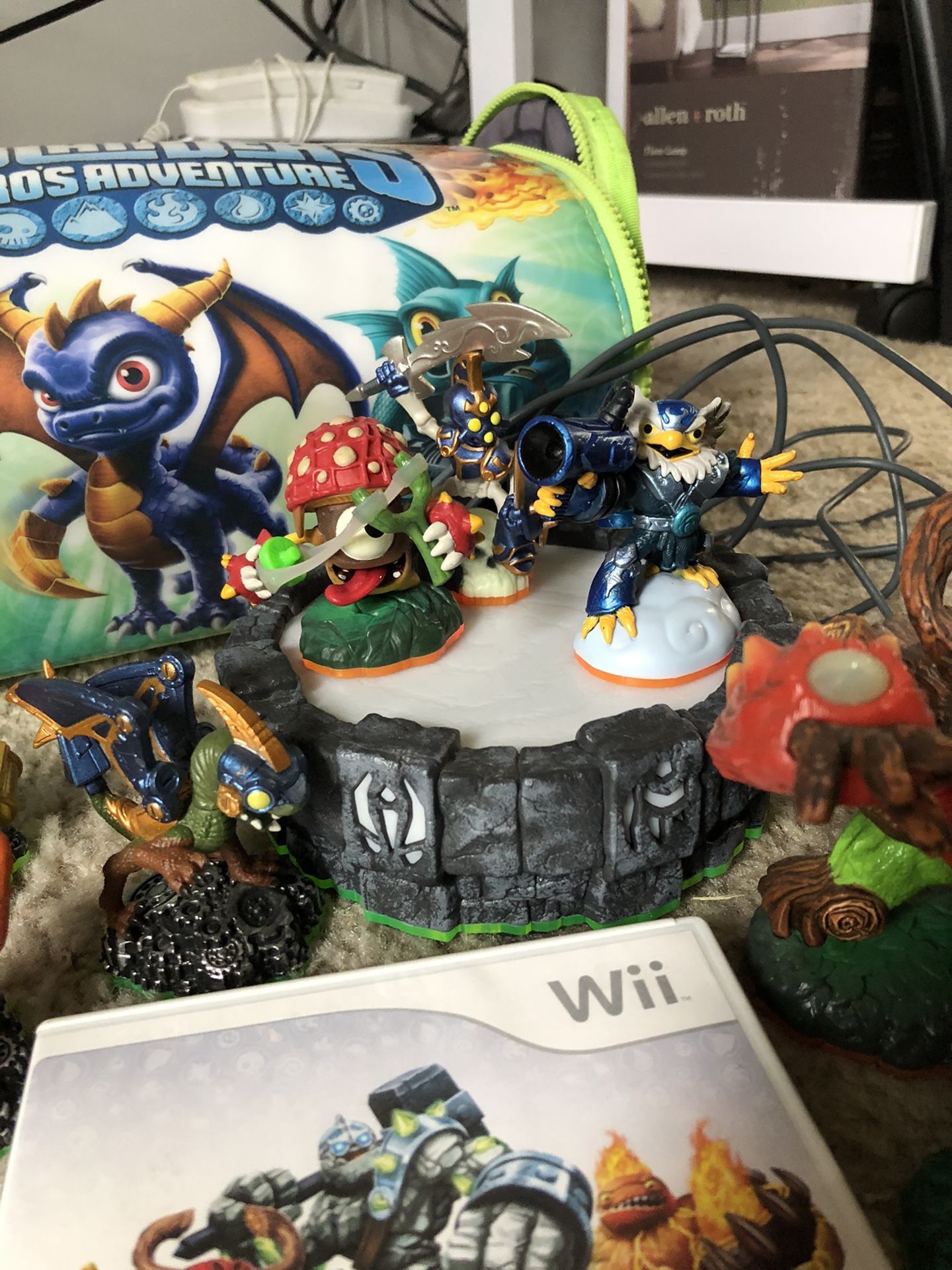 Skylander Wii games and 16 characters with carrying case