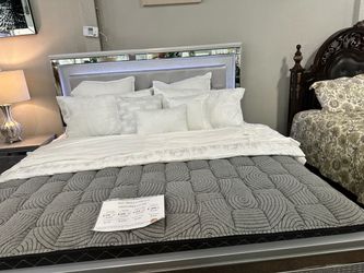 New queen, size bed frame, and headboard and small side drawer