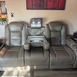 Ashley Furniture Gray Leather reclining sofa