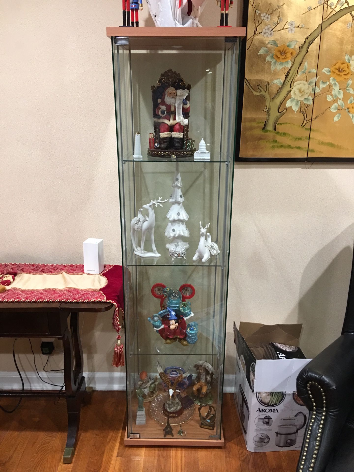 Two shelf curio this lovely cabinet brings chic display to any space. Highlight favorite family photos or share your treasured