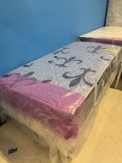 New twin mattress and box spring 2 pc bed frame is not included