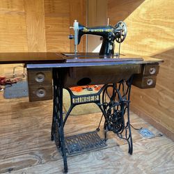 Antique Vintage Singer sewing machine in cabinet. Treadle Table Wrought Iron.