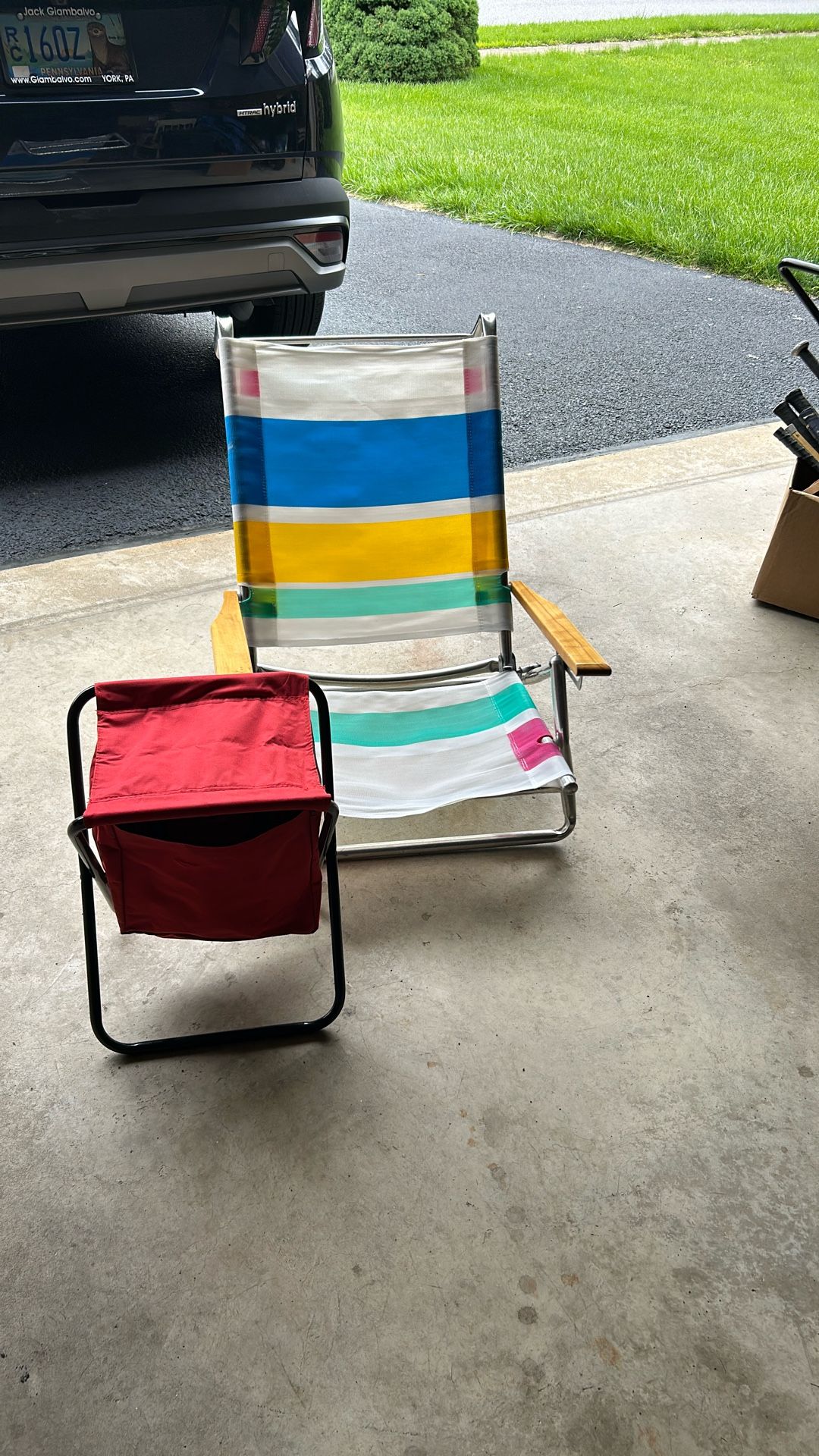 Two chairs for $10 Red Folding Chair Has Insulated Zipper Compartment to keep things cold or warm