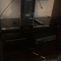 Black layered entertainment stand with a mount