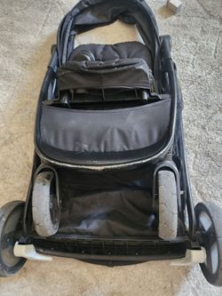 Graco Doble Stroller With The Car Seat For Newborn And A Extra Sit When They Are A Little Older 