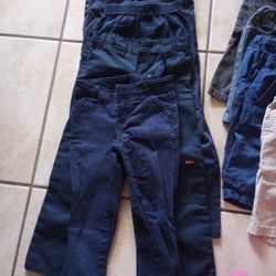 Bunch Of Uniforms And Shoes